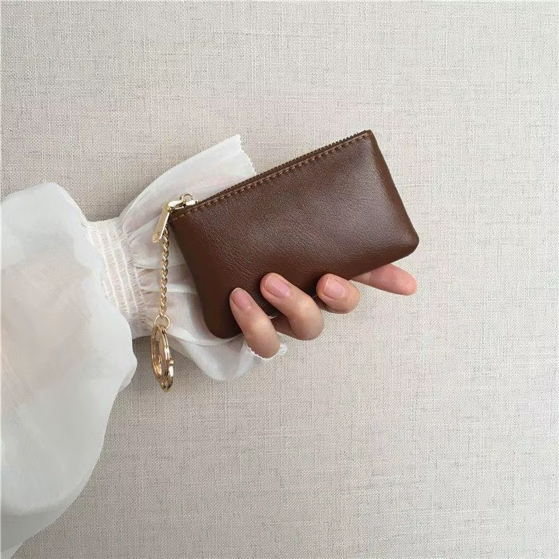Mini porte-monnaie en cuir PU avec porte-clés doré et fermeture éclair lisse, parfait pour un usage 