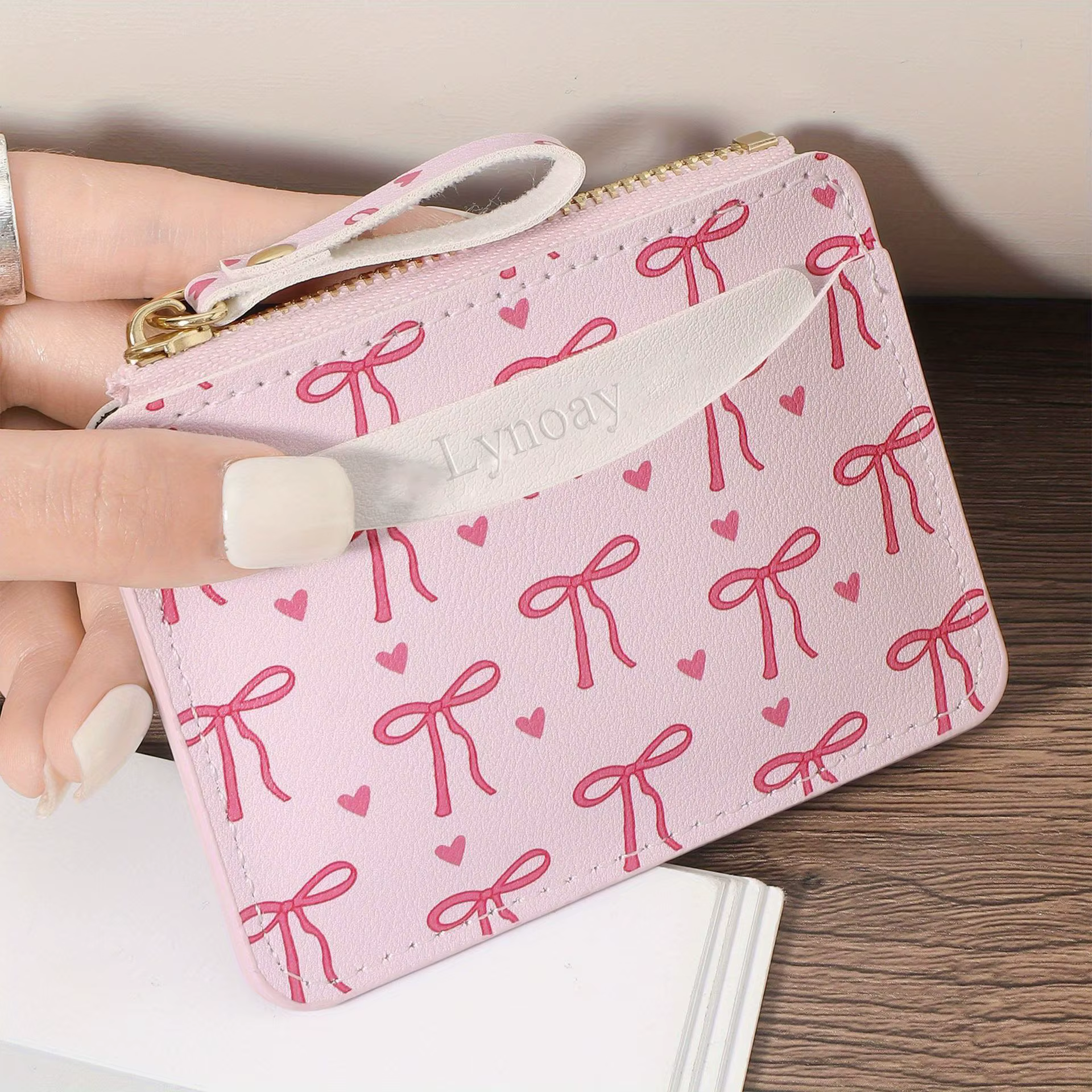 Portefeuille ultra-fin à fermeture éclair pour femme : porte-cartes rose avec nœud en forme de cœur,