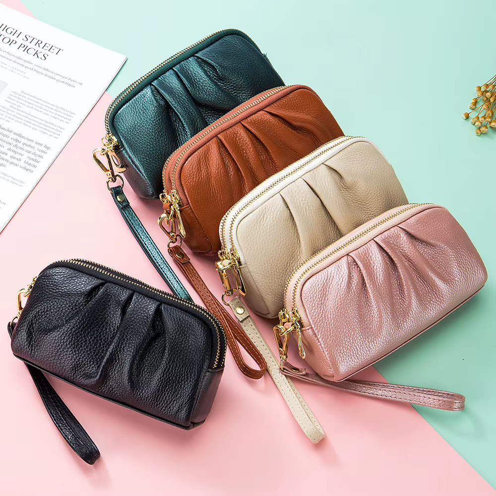 Nouveau 2025 polyvalent dame portefeuille contraste couleur porte-clés chaîne Style véritable couche supérieure en cuir de vache fermeture éclair pièces de monnaie poche sac à main