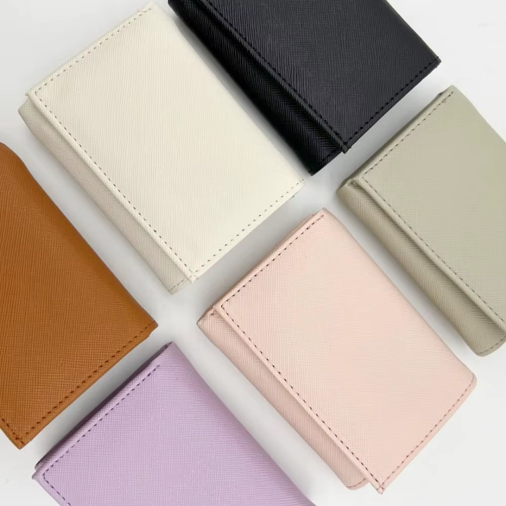 Porte-monnaie portable à trois volets avec boucle anti-perte