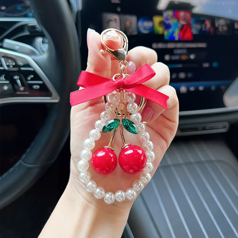 Porte-clés créatif cerise avec nœud et perles
