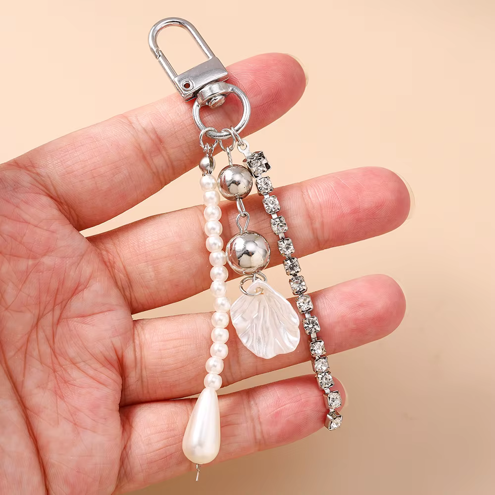 Joli porte-clés en forme de coquille de perles pour femmes et filles