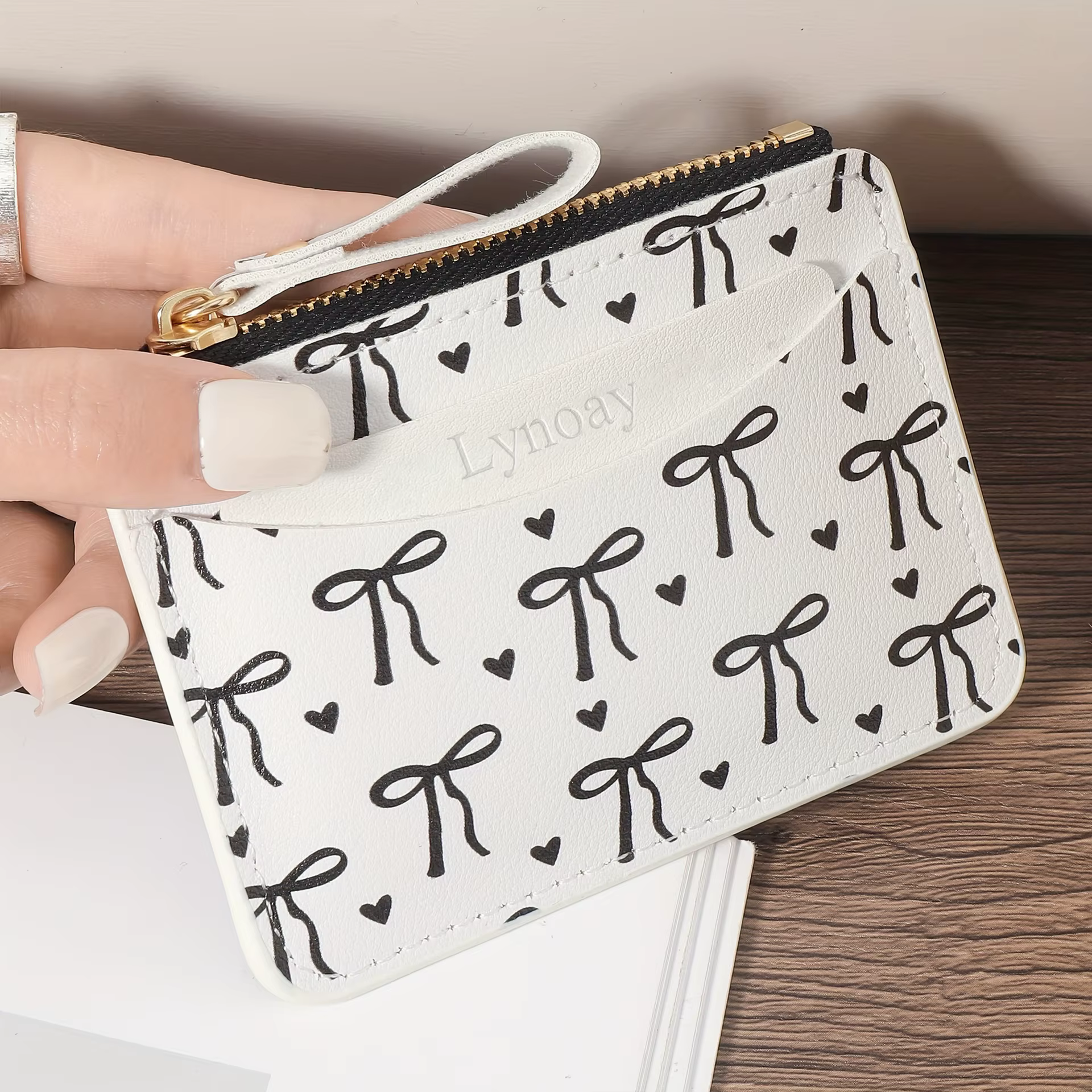 Portefeuille ultra-fin à fermeture éclair pour femme : porte-cartes rose avec nœud en forme de cœur