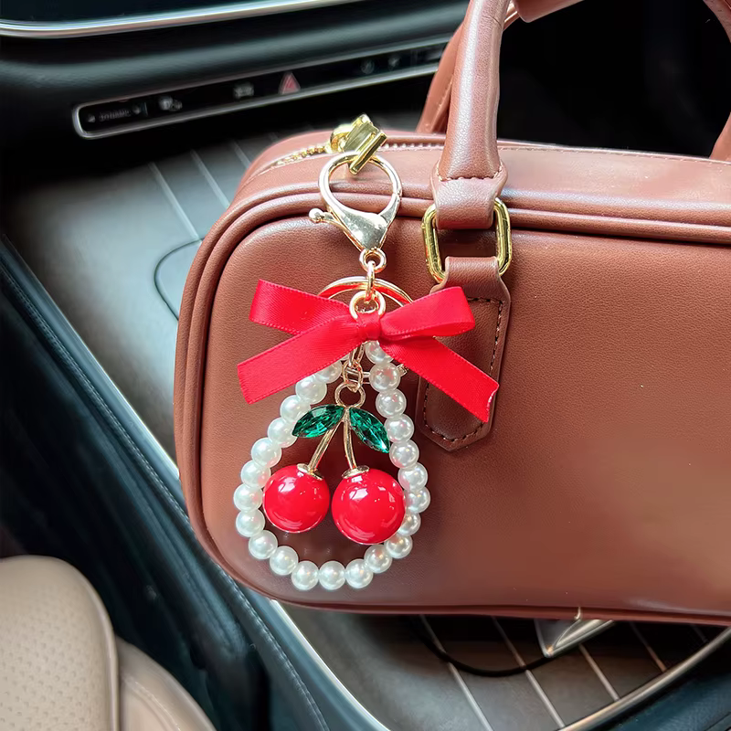 Porte-clés créatif cerise avec nœud et perles
