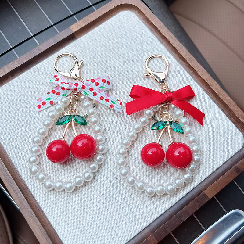 Porte-clés créatif cerise avec nœud et perles