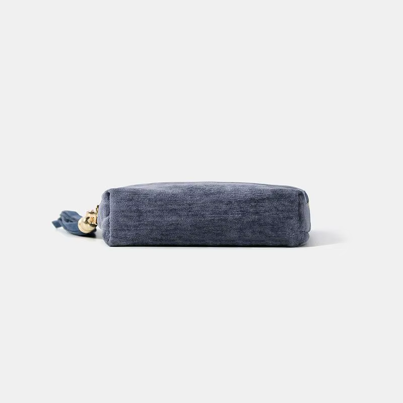 Mini porte-monnaie en velours avec fermeture éclair dorée et pompon